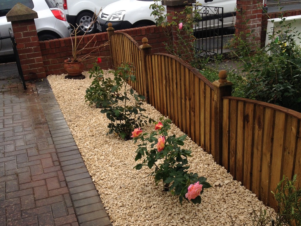 Front garden area with new plants and decorative stone